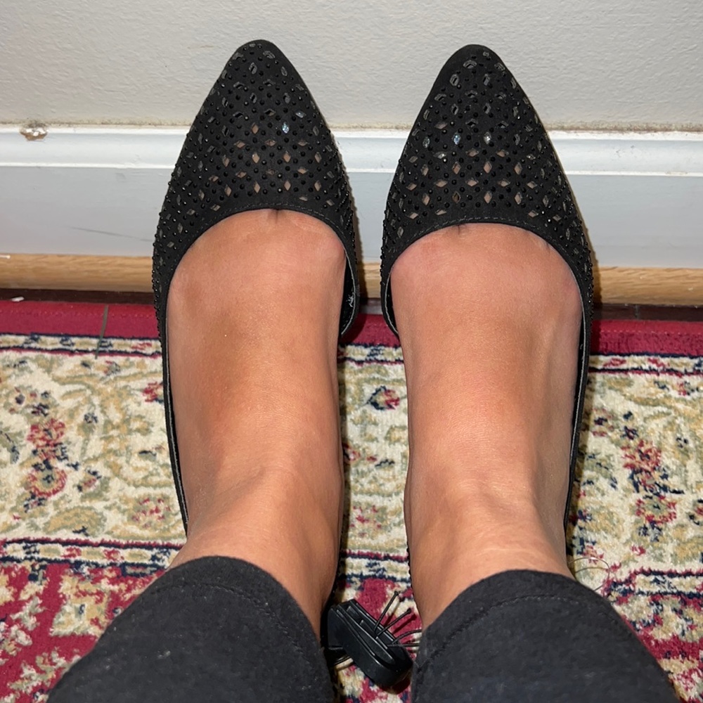 black sparkly flats with perforated design pointy toed